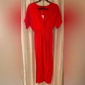 Deep v red dress with front slit and drapey sleeves